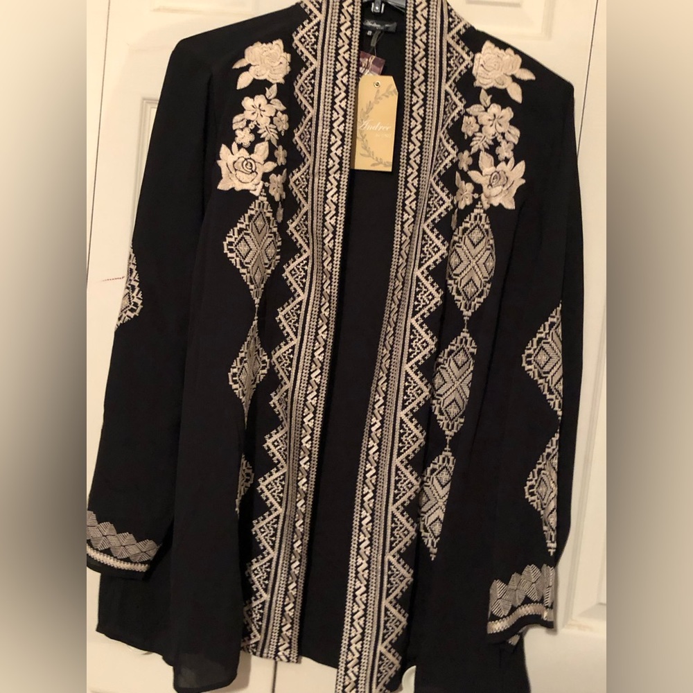 Ladies light-weight jacket-type…black with cream colored embroidery. (2x)